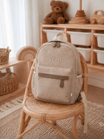 Welcomenest herringbone personalised backpack on rattan chair, name Noah